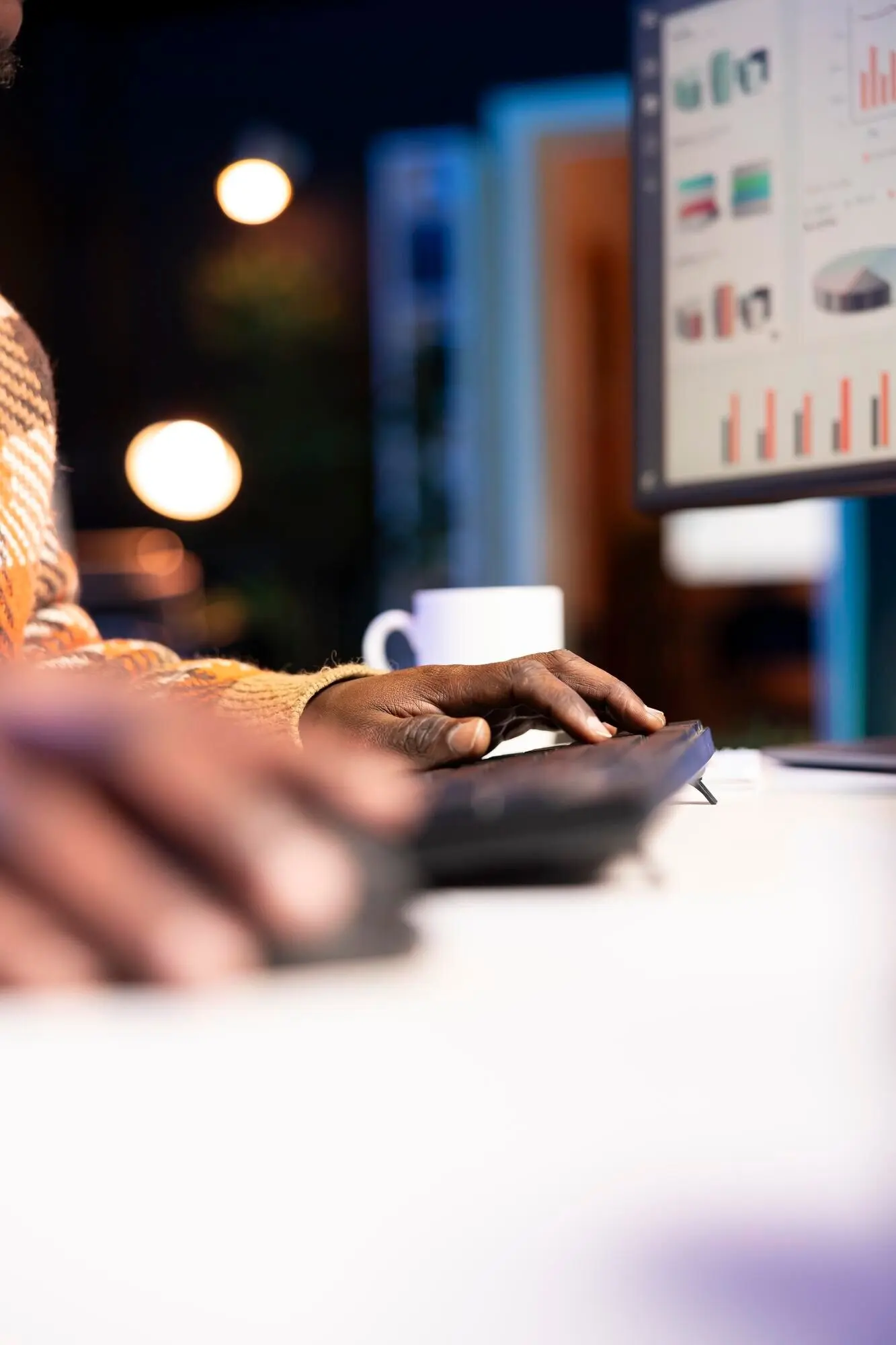 An African American specialist finalizing the monthly revenue balance